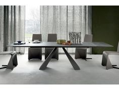 a modern dining table with chairs around it