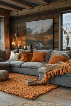 a living room filled with lots of furniture and large windows covered in wood planks