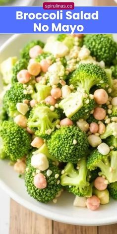 broccoli salad with chickpeas in a white bowl on a wooden table