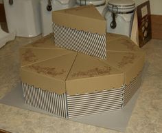 three boxes are stacked on top of each other in the middle of a bathroom counter