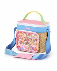 a pink and blue lunch bag with sprinkles on the inside, sitting on a white surface