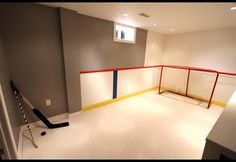 an empty room with a hockey goal in it