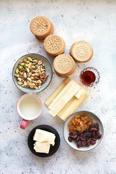 a table topped with plates and bowls filled with different types of food next to each other