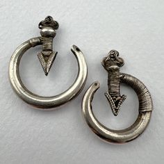 2 old Yao silver earrings - not a pair - from the Hill Tribe people of Northern Thailand, Laos and Myanmar. 1940's.  Small - 22mm wide - 5.9grams Lg. - 26mm wide - 7.1 grams Traditional Silver Single Earring, Silver Drop Earrings For Ceremonial Occasions, Antique Style Silver Earrings For Pierced Ears, Ceremonial Silver Drop Earrings, Antique Silver Plug Earrings With Matching Pair, Antique Silver Pendant Earrings, Vintage Sterling Silver Earrings For Ceremonial Occasions, Silver Round Ceremonial Earrings, Traditional Silver Metal Clip-on Earrings