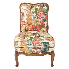 an upholstered chair with flowers on it