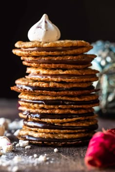 a stack of cookies with marshmallows on top