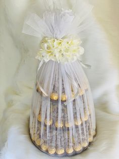 a bag filled with cookies and flowers on top of a white furnishce background