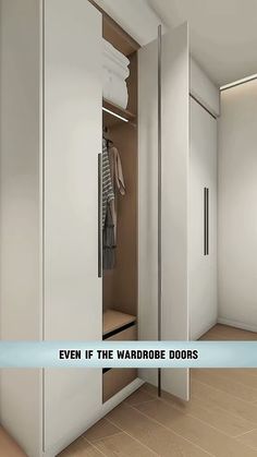 an open wardrobe door with clothes hanging on it