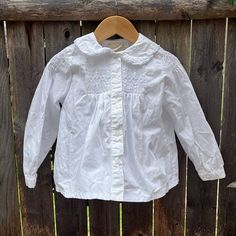 Vintage Laura Ashley Mother & Child 100% Cotton Vintage But Like New Condition- Never Worn. Slight Discoloration On The Tag Only. Size 5t Excellent Quality And So Cute With The Embroidered Details White Long Sleeve Smocked Top With Smocked Cuffs, White Long-sleeve Top With Smocked Back, White Long Sleeve Smocked Top, Long Sleeve Ruffle Tops For School, Long Sleeve Ruffled Tops For School, Spring School Tops With Peter Pan Collar, Spring Tops With Peter Pan Collar For School, Classic Spring Blouse For School, Long Sleeve Cotton Tops With Smocked Back