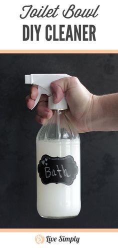 a hand is holding a bottle with soap on it that says toilet bowl diy cleaner