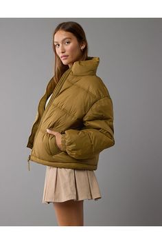 Puffer jacket construction for keeping warm/Mock neck with full zip-up front/Front pockets with zipper closures Tan Puffy Jacket Outfit, Solid Color Outerwear With Zipper Closure And Stand Collar, Fall Puffer Quilted Jacket, Versatile Puffer Outerwear For Cold Weather, Fall Puffer Outerwear For Cold Weather, Trendy Fall Puffer Outerwear, Puffer Outerwear With Stand Collar For Cold Weather, Cold Weather Puffer Outerwear With Stand Collar, Solid Quilted Jacket For Outdoor Fall Use