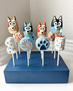 an assortment of cake pops with cartoon characters on them