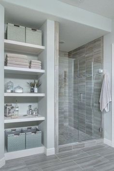 a walk in shower sitting inside of a bathroom