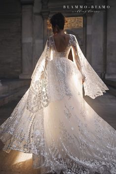 the back of a wedding dress with long sleeves