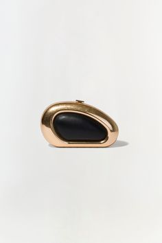 FALL 2024 WOMEN'S COLLECTION The Luna Clutch in Black Gold. Featuring a sleek gold frame and sophisticated black center, elevate your evening ensemble with this chic oval clutch. Elegant Structured Clutch For Formal Occasions, Elegant Structured Formal Clutch, Elegant Evening Bag With Gold-tone Hardware, Elegant Evening Bag With Gold-tone Hardware For Formal Events, Luxury Gold Clutch For Gala, Elegant Formal Evening Bag With Gold-tone Hardware, Modern Structured Clutch For Formal Occasions, Formal Structured Clutch, Luxury Gold Clutch For Cocktail