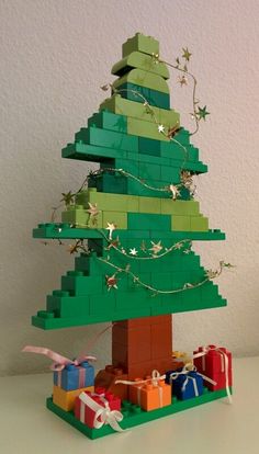 a lego christmas tree with presents under it