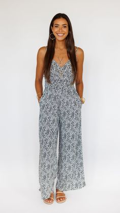 Stand out in this stunning jumpsuit, made to flow with buttery soft rayon and an exaggerated wide pant leg. Features adjustable straps and a gentle smocked waist to flatter. ** Our Model is 5'8" and wearing a size SMALL. ** Fabric and Care Instructions: *100% Rayon *Hand wash cold * Line Dry Wide Pants, Retail Boutique, Care Instructions, Casual Jewelry, Adjustable Straps, Signature Jewelry, Opal, Jumpsuit, Hand Wash