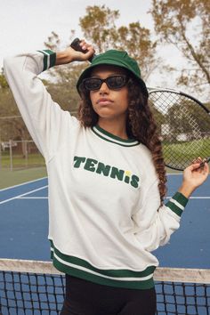 Serve up some looks in this adorable tennis sweatshirt!  Self: 100% Cotton Art:  Chenille - 100% Acrylic Lightweight french terry sweatshirt Elasticated neck, hem and cuffs Crewneck  Fit   True to size  Garment Care  Hand-wash | hang dry  Machine wash cold | hang-dry Sweater will shrink slightly if put in dryer We recommend hand washing the sweaters and hang drying.  Should you need to machine wash, please do so on cold and hang dry, they will shrink slightly if put in the dryer. Tennis Sweatshirt, Cotton Art, Independent Designers Fashion, Kid Names, Oversized Fits, French Terry, Cream Color, Tennis, Cotton Blend