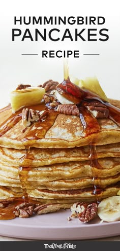 a stack of pancakes covered in syrup and sliced bananas