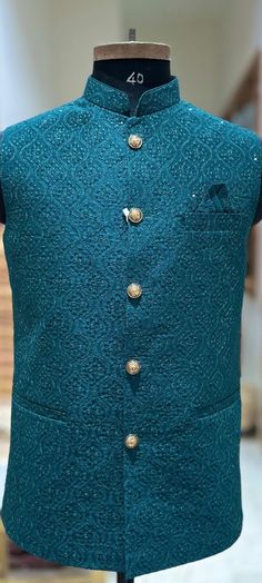 Product Description This sleeveless jacket is crafted with intricate embroidery and sequins. It is lightweight yet high on durability carrying a distinct texture and appearance. It enhance the elegance of men's wear from formal to casual, wedding, and other auspicious occasions. The jacket is also known as Indian or Ethnic Style Jacket, Collar Waistcoat, Sadri, Nehru or Modi Jacket. Pair it with Kurta-Pajama for ethnic look. Pair it with Shirt & Trousers to give a Indo-Western look. Fabric : Silk blend Design: J- 1458 Actual color of the dress may slightly vary due to the screen resolution. Refer the size chart for measurements Care: Dry cleaning is recommended Sleeveless Embroidered Nehru Jacket For Designer Wear, Designer Sleeveless Embroidered Nehru Jacket, Festive Embroidered Sleeveless Bandhgala, Sleeveless Embroidered Bandhgala For Festive Season, Festive Sleeveless Embroidered Bandhgala, Designer Embroidered Green Outerwear, Embroidered Sleeveless Nehru Jacket For Festive Occasions, Festive Nehru Jacket With Intricate Embroidery For Winter, Traditional Embroidered Sleeveless Outerwear