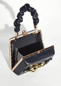 This Chain Decor Eco Leather Mini Square Bag is a stylish and environmentally-friendly accessory that is perfect for any occasion. Made of high-quality eco leather, this bag features a chic chain decoration and comes in a sleek black color. Add a touch of sophistication to your outfit while also supporting sustainability. Material: Polyurethane Luxury Black Box Bag With Chain Strap, Chic Leather Box Bag With Chain Strap, Black Handheld Box Bag, Elegant Top Handle Bag With Chain, Black Clutch Box Bag As Fashion Accessory, Leather Clutch With Chain Strap For Night Out, Trendy Black Box Bag For Party, Elegant Box Bag With Chain, Trendy Black Square Evening Bag