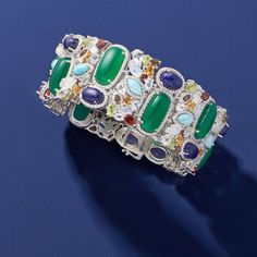 Ross-Simons - 90.00 ct. t. w. Multi-Gemstone Bracelet in Sterling Silver. 7". An RS exclusive. An explosion of colors, shapes and textures, this bracelet will take your breath away! Nestled amongst beaded frames of sterling silver are a bright mix of large green chalcedony, lapis, Larimar, moonstone, citrine, smoky quartz, white and blue topaz, peridot and garnet gems, 90.00 ct. tot. gem wt. Bold and beautiful, our design is the perfect complement to your neutral-colored outfits. 1 1/8" wide. Do Luxury Gemstone Bangle Bracelets, Luxury Bangle Bracelets With Gemstone Accents, Luxury Multicolor Gemstones, Luxury Multicolor Natural Gemstones, Luxury Multicolor Gemstone Bracelets, Formal Multi-stone Gemstone Bangle, Luxury Multicolor Stone Bracelets, Luxury Multicolor Bracelets With Stones, Luxury Multicolor Multi-stone Bracelets