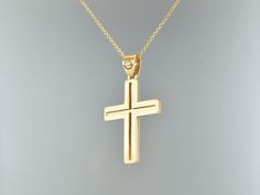 It is a simple cross, matte in front and glossy at the back side. You may take it in order to baptize or as a gift for the man of your life and for that it has the most adequate shape of 31x18mm, neither small nor big. I can create it in 9k, 14k or 18k.Please, feel free to ask me anything you want to know. The 14k version is ready to ship, but the 9k version must be created.It is 2,4 gr in 14k.Please, feel free to ask me anything you want to know. The chain is not included. FOR GOLD CHAIN LOOK AT: https://www.etsy.com/listing/1171632183/chain-1-silver-13mm-paxos-2-silver-18mm3?click_key=09a797b9bf56fd8fac6d90f3c8fd2e96a439c0d7%3A1171632183&click_sum=aec730d6&ref=shop_home_active_1&frs=1. Cheap Gold Men's Cross Necklace, Mens Cross Pendant Gold, 14k Gold Tarnish-resistant Cross Pendant Necklace, Yellow Gold Tarnish-resistant Crucifix Necklace, Gold Cross Necklace Mens Jewelry1000.com, Mens Cross Necklace, Personalized Cross, Fine Gold Jewelry, Mens Crosses