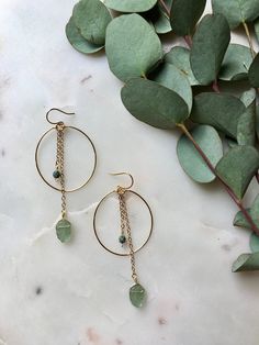 HOLIDAY ORDER DEADLINE: Orders placed after December 18 will not be shipped until January 3!  Clear aqua, green, or turquoise leaf chain dangles on a gold wire hoop. Including the ear wire, they are 3in long by 1 1/8in wide. Made with gold plated wire; wire wrapped detail to secure the hoop is attached to an elegant ear wire. If you have allergies that restrict which metals you can wear, please send me a message first before purchasing. Visit poppyjewelrydesigns.com for more inventory and new st Gold Jade Hoop Jewelry, Green Bohemian 14k Gold Filled Earrings, Adjustable Green Teardrop Jewelry, Adjustable Teardrop Green Jewelry, Green Adjustable Teardrop Jewelry, Green Minimalist Metal Jewelry, Minimalist Green Metal Jewelry, Green Wire-wrapped Dangle Hoop Earrings, Green Wire Wrapped Dangle Hoop Earrings