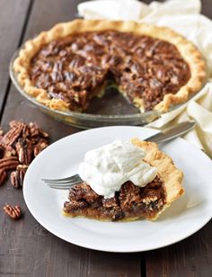 a piece of pecan pie on a plate with a fork