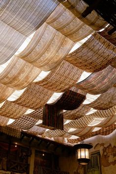 the ceiling is covered with woven fabric