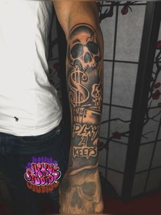 a man's arm with a skull and dollar sign tattoo on the left sleeve