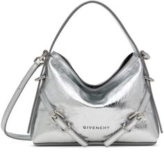 Laminated grained lambskin shoulder bag in silver tone. · Carry handle · Detachable crossbody strap · Logo stamp at face · Pin-buckle straps at face · Open throat · Canvas lining · Logo-engraved silver-tone hardware · H5.5 x W6.5 x D1.5 Supplier color: Light silvery Silver Shoulder Bag With Top Handle And Silver-tone Logo, Evening Shoulder Bag With Silver-tone Logo, Chic Top Handle Bag With Silver-tone Logo Plaque, Metallic Shoulder Bag With Silver-tone Logo For Evening, Metallic Shoulder Bag For Evening With Silver-tone Logo, Metallic Bags With Silver-tone Logo Plaque For Formal Occasion, Designer Silver Shoulder Bag With Adjustable Strap, Silver Designer Shoulder Bag With Detachable Strap, Designer Silver Shoulder Bag With Detachable Handle