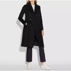 This Is A Pre-Owned Coach Women's Coat In Size Xs. It Is A Double-Breasted, Long-Sleeved Coat With A Classic Collar. The Coat Is Made Of 100% Cotton And Has A Lining Of 56% Polyester And 44% Cotton. The Coat Is Black In Color And Has A Subtle Sheen. It Features A Single Button Closure At The Waist And Two Flap Pockets At The Hips. The Coat Is In Good Condition With Some Minor Wear. The Lining Is In Great Condition With No Visible Tears Or Stains. The Coat Is Missing Belt Which Can Easily Be Repl Trench Coat Black, Coach Jacket, Long Sleeves Coats, Coats Jackets Women, Vest Jacket, Double Breasted, Coats For Women, Trench Coat, Coats Jackets