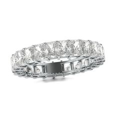 a white gold ring with four rows of round cut diamonds on the sides and three rows of baguetts in the middle