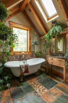 a bathroom with a claw foot bathtub, sink and plants on the counter top