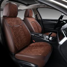 the interior of a car with brown leather and black trim, including two rows of seats