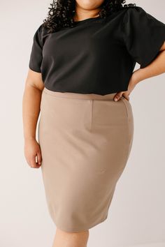 With clean, simple lines and sophisticated style, the 'Anna' is the perfect pencil skirt your closet has been waiting for. Quality fabric, full lining and structured style ensure a modest and flattering fit while an elastic waistband keeps you comfortable. Exclusively designed with you in mind! 68% Rayon 27% Nylon 5% Spandex Hand Wash Cold Separately or With Like Colors Do Not Bleach Hang to Dry Low Iron if Needed 1.75" Waistband Fully Lined ﻿Color may be slightly darker than shown Model Height Sleek Pencil Mini Skirt For Work, Sleek Pencil Skirt For Business Casual, Sleek Spring Pencil Skirt For Business Casual, Sleek Solid Skirt For Workwear, Sleek Solid Color Workwear Skirt, Sleek Workwear Skirt, Beige Lined Pencil Skirt For Work, Beige Lined Pencil Skirt For Workwear, Beige Midi Pencil Skirt For Work