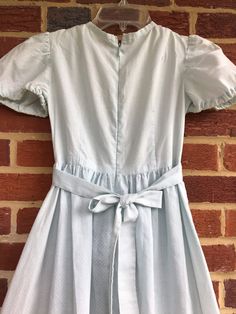 "Pre-love Swiss dot dress/if you were looking for new this is not for you/no stains just soft and cozy plenty of wear-arm elastic is no longer functional/The color did not photograph well it is a light aqua/pit to pit 13\"-waist 12\"/length (shoulder to bottom) 43\"/Smoke-free environment/No stains or rips-again just a lot of wear-Total prairie look along with cottage core(22)" Cottagecore Fitted Dress For Tea Party, Vintage Spring Dress For Tea Party, Vintage Spring Dresses For Tea Party, Vintage Dress For Spring Tea Party, Vintage Dresses For Spring Tea Party, Retro Summer Dresses For Dress-up Occasions, Fitted Cotton Dresses For Tea Party, Fitted Modest Cotton Maxi Dress, Pastoral Cotton Dress For Garden Party