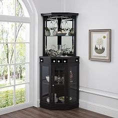 a black corner cabinet with glass doors in a living room