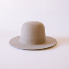 Note: The Salton is a bandless hat. Feel free to wear it without a band, or add your own flair to it. It's great hat to make your own. DESCRIPTION As an open crown hat, the Salton has no creases, pinches or dents. It can be worn as is — round — or you can try your hand at shaping it yourself. Either way, the Australian wool is easy to clean and will hold up for years if it's treated right. HAT SIZE CHART Side note: This hat fits true to size. All sizes are measured in centimeters circumference. Hat Size Chart, Hat Fits, Crown Hat, Feather Hat, Dad Caps, Silver Fox, Felt Hat, Hat Band, Kids Hats