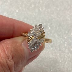 "Up for sale is this attractive vintage estate 14 karat solid yellow gold diamond waterfall cluster cascade cocktail ring in size 5.25.  The ring features 24 round diamonds approximately 2mm diameter each or approximately .70 TCW in a cluster setting.  The face of the ring measures 3/8\" by 5/8\".  The piece weighs 3.8 grams.  The inside of the ring is marked 14K.  Note that some photos are enlarged to show details. Buy with confidence!  This ring has been verified 14 karat solid gold by X-ray spectrometry.  All diamonds have been tested genuine. Condition:  This ring is pre-owned and vintage and as-such, expect wear... minor surface wear or other minor imperfections, and the piece may need to be cleaned.  That said, this piece appears lightly worn.  This ring is sold in as-is condition. P Sparkling Cluster Jewelry For Anniversary, Sparkling Diamond Cluster Ring For Anniversary, Anniversary Cluster Ring Stamped 14k, Collectible Cluster Diamond Rings, Diamond White Cluster Diamond Ring Stamped 14k, Vintage Style Cluster Diamond Cut Ring, Cluster Diamond Ring For Anniversary, Gold Collectible Cluster Ring, Vintage Cluster Cubic Zirconia Rings