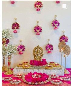 a decorated table with pink and gold decorations