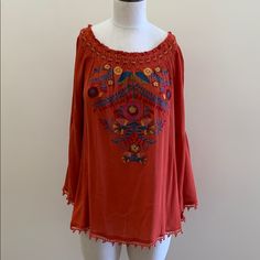 Super Cute On Or Off The Shoulder Embroidered Top. Beautiful Rust Top With Mustard, Real And Burgundy Embroidery. Red Long Sleeve Top With Intricate Embroidery, Red Floral Embroidered Top, Red Embroidered Top With Embroidered Hem, Spring Red Blouse With Resham Embroidery, Red Embroidered Top With Resham For Summer, Red Blouse With Resham Embroidery For Spring, Red Resham Embroidered Top For Summer, Red Folk Tops With Floral Embroidery, Red Embroidered Festival Tops