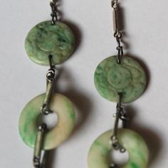 -Antique Chinese Enamel Carved Jadeite & Disk Necklace -Total length: 16 in -Biggest disk size: 25 mm -Small disk size: 17 mm -Carved jadeite:about 15 mm ~ 16 mm -Total weight: 15.7 g -It's uneven, one side have two carved jadeite and a disk, another size have one jadeite and a disk Vintage Jewelry With Natural Round Stones, Formal Round Jade Jewelry, Vintage Jade Round Pendant Jewelry, Vintage Jade Round Earrings, Vintage Green Jewelry With Natural Stones, Collectible Jade Pendant Jewelry, Collectible Round Jade Jewelry, Round Jade Collectible Jewelry, Unique Green Round Jewelry