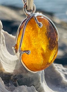 Pendant material and details : * Honey Amber and Sterling Silver  * Stone : Natural Baltic Amber * Silver hallmark :Ag 925 * Pendant length : 5,5 cm * Pendant width: 3,5cm * Pendant weight: 13,0  g *Color :  White , Yellow Luxury Artisan Amber Jewelry, Silver Baltic Amber Jewelry As Gift, Silver Baltic Amber Jewelry For Gift, Polished Baltic Amber Pendant Jewelry, Baltic Amber Pendant With Polished Finish, Silver Baltic Amber Oval Jewelry, Baltic Amber Pendant Jewelry With Polished Finish, Handmade Baltic Amber Oval Jewelry, Handmade Baltic Amber Teardrop Jewelry