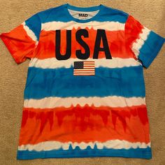 Usa Patriotic Stripe T-Shirt By Mad Engine. Size Xl. In Brand New Condition, Never Worn! Casual Crew Neck T-shirt With Flag Print, Multicolor Short Sleeve Shirt For 4th Of July, Casual Blue Tops With American Flag Print, Blue T-shirt With American Flag Print For Spring, Patriotic Multicolor Short Sleeve T-shirt, Multicolor Flag Print Casual T-shirt, Casual Cotton T-shirt For 4th Of July, Casual Red T-shirt With American Flag Print, Casual T-shirt With American Flag Print