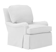 a white chair that is upholstered with a pillow on the back of it