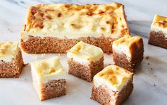 several pieces of cake sitting on top of a table