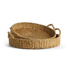 two round woven baskets with handles on each side, one is empty and the other has an oval handle