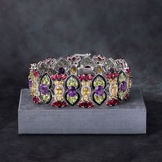 Ross-Simons - 56.35ct t. w. Multi-Gemstone, Black Enamel Bracelet in Silver. 8". An RS exclusive. Flash this remarkable bracelet for instant acclamation - works every time! The design evokes high spirits with vivid color, featuring an astounding 56.35 ct. t. w. multi-shaped peridots, citrines, rhodolite garnets, amethysts and white topaz accented by black enamel. Crafted in sterling silver. Double-latch safety. Box clasp, black enamel and multi-gemstone bracelet. Peridot birthstones are the perf Multi Gemstone Bracelet, Peridot Birthstone, Safety Box, High Spirits, Bracelet In Silver, Box Clasp, Enamel Bracelet, Rhodolite Garnet, Vivid Color